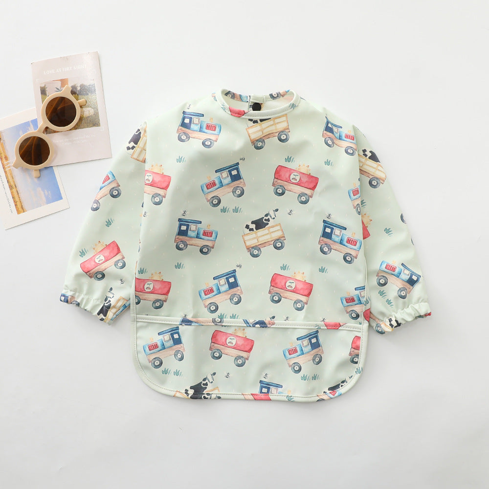 Cars waterproof long-sleeved cape bib with elastic cuffs and catch-all front pocket, laid flat on a neutral background – ideal for messy meals and toddler crafts