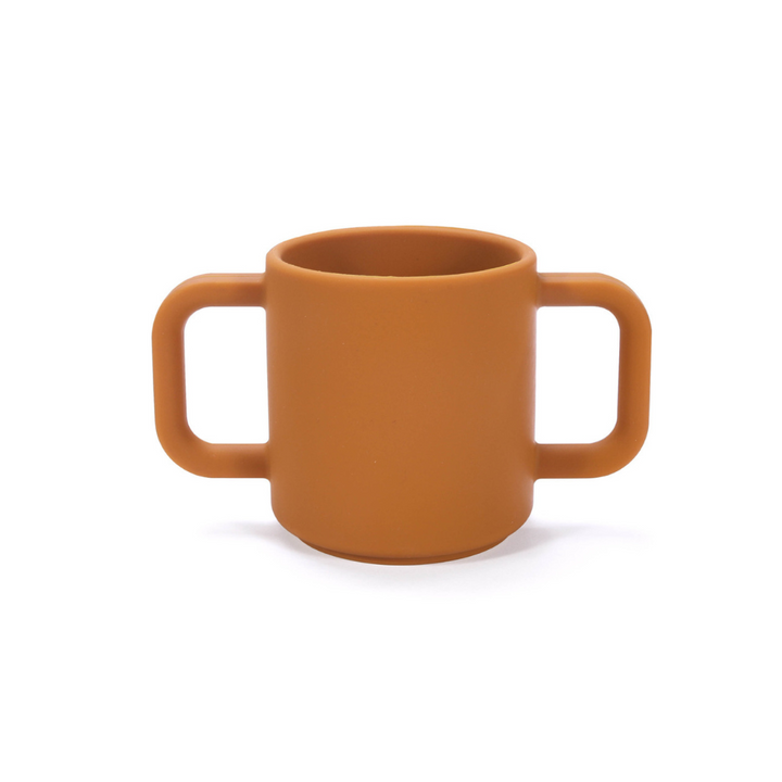 Premium Silicone Open Cup Brown. Premium silicone baby open cup in soft pink with a rounded rim, designed for toddlers learning to drink independently – unbreakable and easy to grip.