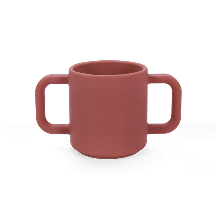 Premium Silicone Open Cup Burgundy. Premium silicone baby open cup in soft pink with a rounded rim, designed for toddlers learning to drink independently – unbreakable and easy to grip.